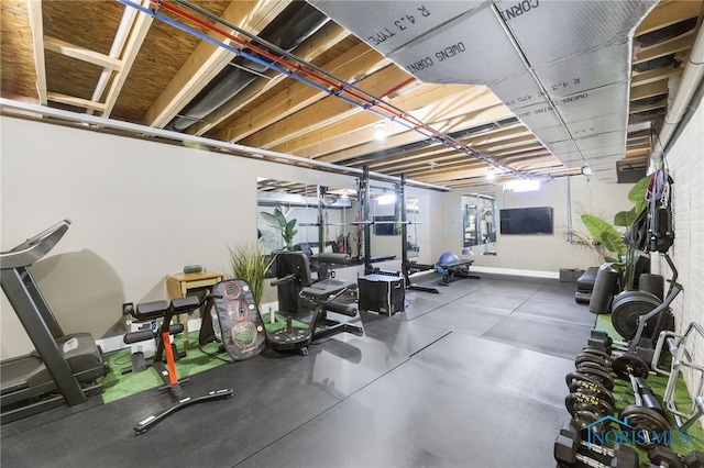 exercise room with baseboards