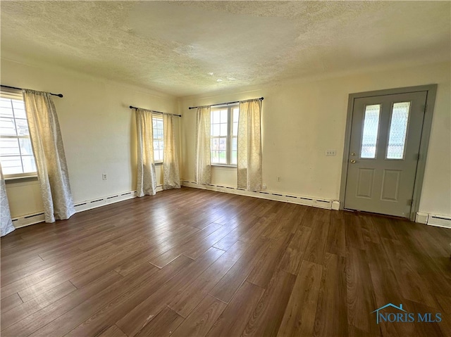 4865 296th St, Toledo, OH 43611 - unfurnished room with a textured ceiling, baseboard heating, and dark wood-type flooring