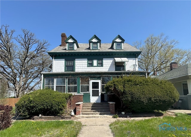 view of front of house with a chimney