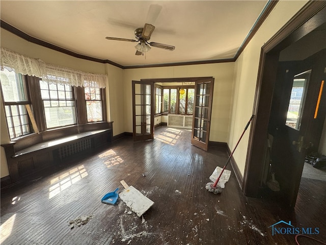 spare room featuring baseboards, ceiling fan, french doors, and crown molding