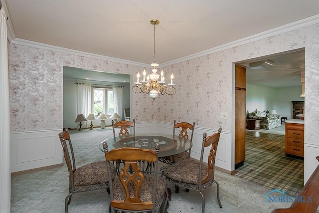 400 Orchard View Dr, Maumee, OH 43537 - carpeted dining space featuring wallpapered walls, a chandelier, wainscoting, ornamental molding, and a decorative wall