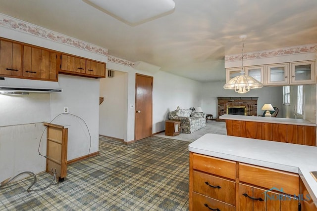400 Orchard View Dr, Maumee, OH 43537 - kitchen featuring extractor fan, light countertops, dark carpet, and brown cabinets