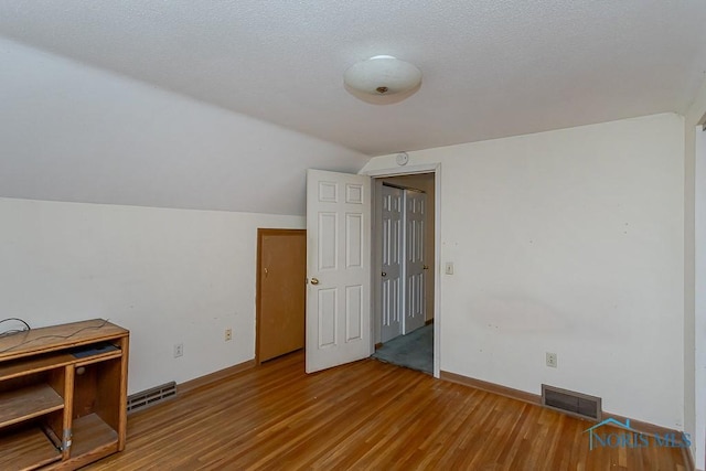 400 Orchard View Dr, Maumee, OH 43537 - additional living space featuring vaulted ceiling, wood finished floors, and baseboards