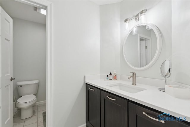 544 Jacqueline Ct, Holland, OH 43528 - bathroom featuring vanity, toilet, baseboards, and tile patterned floors