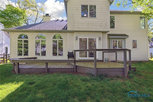 544 Jacqueline Ct, Holland, OH 43528 - rear view of house with a lawn, a wooden deck, a chimney, and a shingled roof