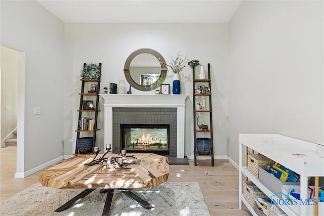 544 Jacqueline Ct, Holland, OH 43528 - living area featuring light wood-type flooring, baseboards, stairs, and a fireplace