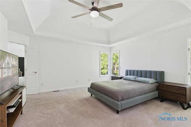 544 Jacqueline Ct, Holland, OH 43528 - bedroom featuring a raised ceiling, light colored carpet, ceiling fan, and baseboards