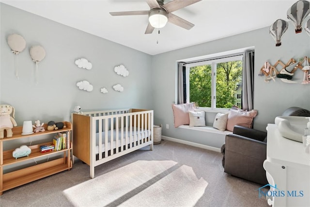 544 Jacqueline Ct, Holland, OH 43528 - bedroom featuring a nursery area, carpet, a ceiling fan, and baseboards