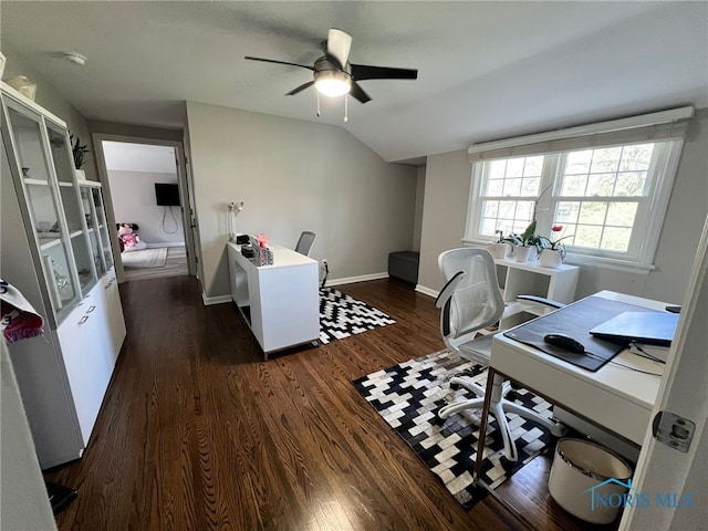 office area featuring dark wood-type flooring, ceiling fan, vaulted ceiling, and baseboards