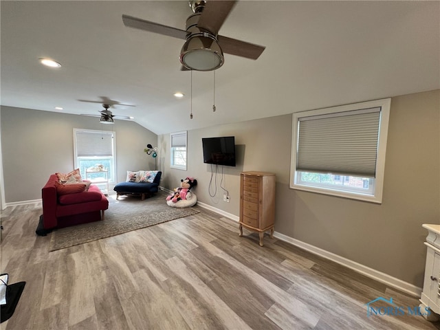 sitting room featuring recessed lighting, wood finished floors, a ceiling fan, baseboards, and lofted ceiling