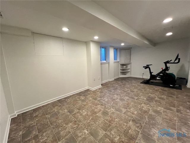 workout area featuring recessed lighting and baseboards