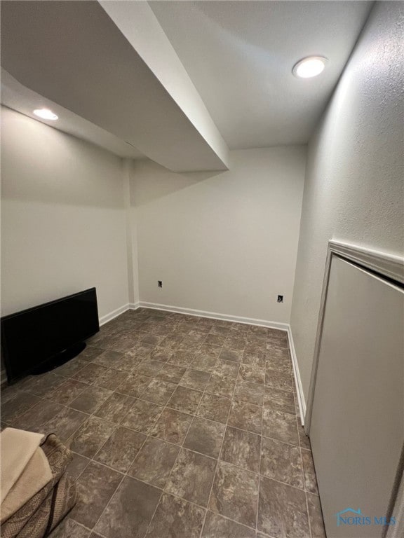 finished basement featuring baseboards