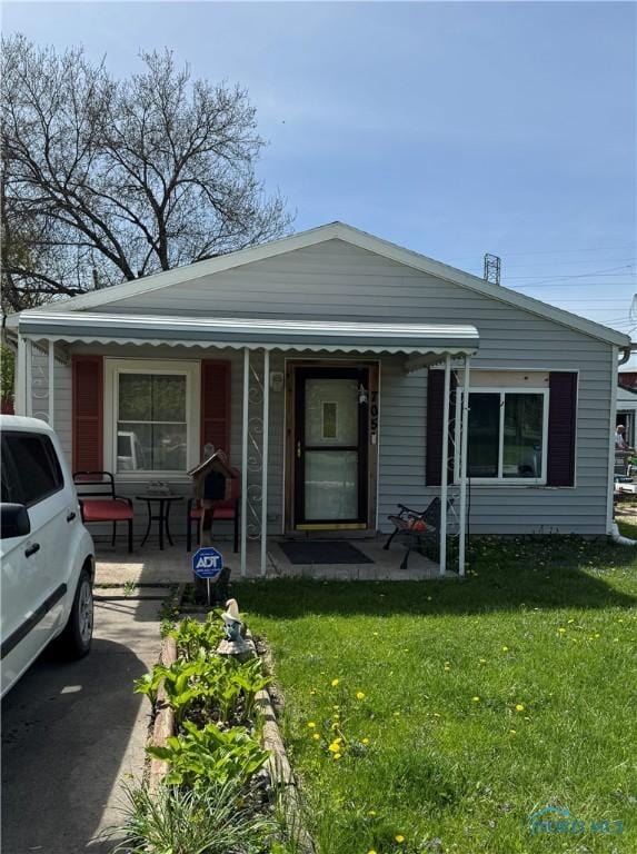 bungalow-style house featuring a front yard and a porch