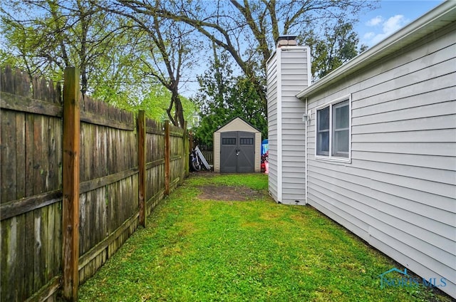 705 Reineck Dr, Toledo, OH 43605 - view of yard with fence, an outdoor structure, and a shed