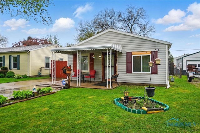 705 Reineck Dr, Toledo, OH 43605 - view of front of home featuring a porch and a front yard