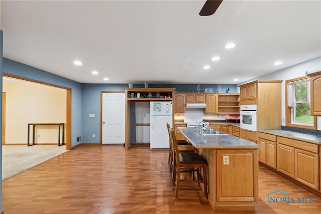 kitchen with recessed lighting, open shelves, under cabinet range hood, and white appliances