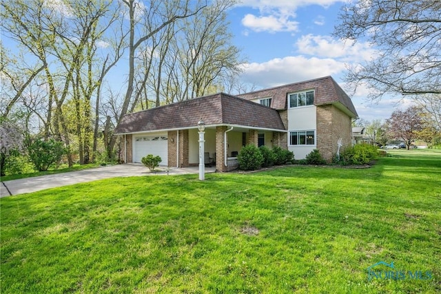 exterior space with an attached garage, brick siding, a lawn, mansard roof, and driveway