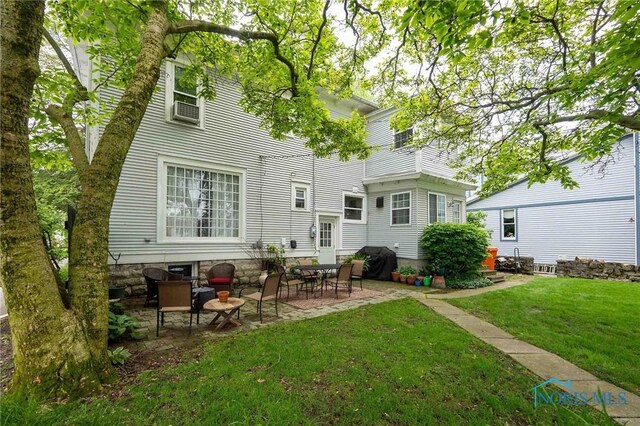 202 Hancock St, Findlay, OH 45840 - rear view of house with a yard and a patio area