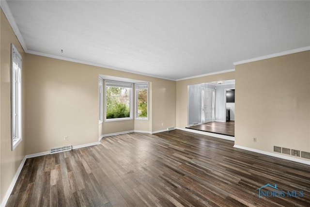 6142 Welsford Ct, Maumee, OH 43537 - unfurnished living room featuring baseboards, ornamental molding, wood finished floors, and visible vents