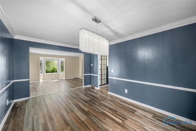 6142 Welsford Ct, Maumee, OH 43537 - spare room featuring baseboards, a chandelier, ornamental molding, and wood finished floors