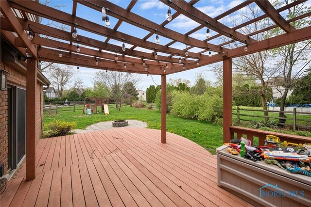 6142 Welsford Ct, Maumee, OH 43537 - wooden terrace with a fire pit, fence, and a yard