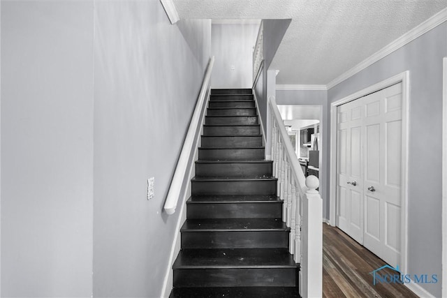 6142 Welsford Ct, Maumee, OH 43537 - staircase featuring crown molding, a textured ceiling, and wood finished floors