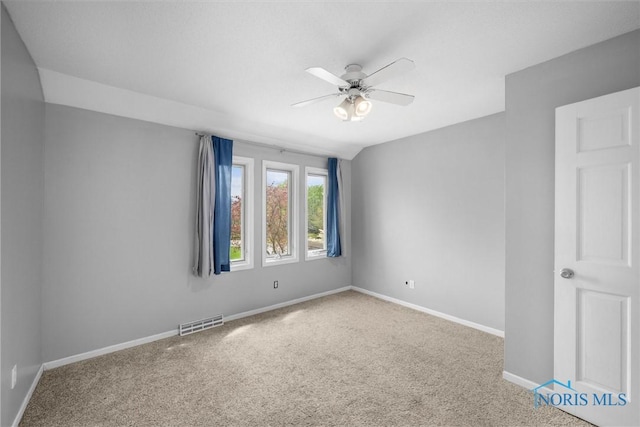 6142 Welsford Ct, Maumee, OH 43537 - carpeted empty room with a ceiling fan, baseboards, and visible vents