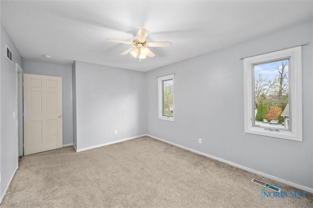 6142 Welsford Ct, Maumee, OH 43537 - unfurnished bedroom with baseboards, visible vents, and carpet