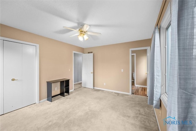 6142 Welsford Ct, Maumee, OH 43537 - unfurnished bedroom featuring a closet, baseboards, light carpet, and a ceiling fan