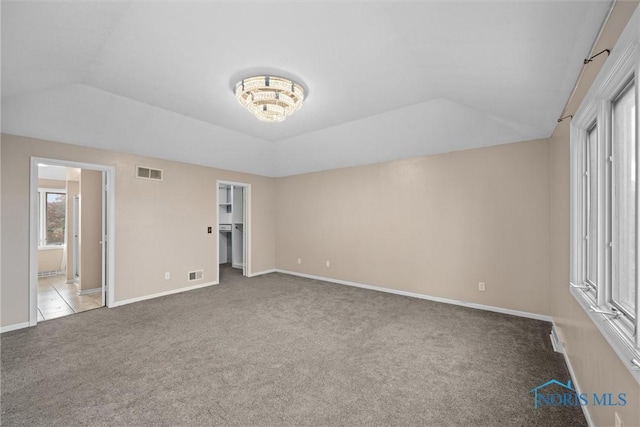 6142 Welsford Ct, Maumee, OH 43537 - unfurnished bedroom with visible vents, baseboards, carpet, and lofted ceiling