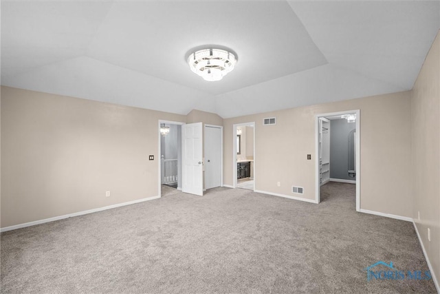 6142 Welsford Ct, Maumee, OH 43537 - unfurnished bedroom featuring visible vents, carpet, and lofted ceiling