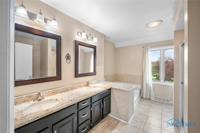 6142 Welsford Ct, Maumee, OH 43537 - full bath with double vanity, tile patterned floors, visible vents, and a sink
