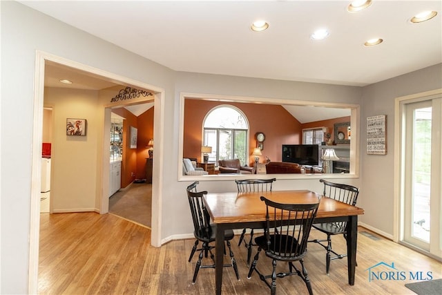dining area featuring a healthy amount of sunlight, recessed lighting, and light wood finished floors