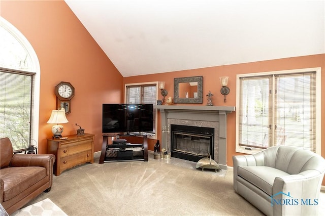 living room with a premium fireplace, a wealth of natural light, and carpet