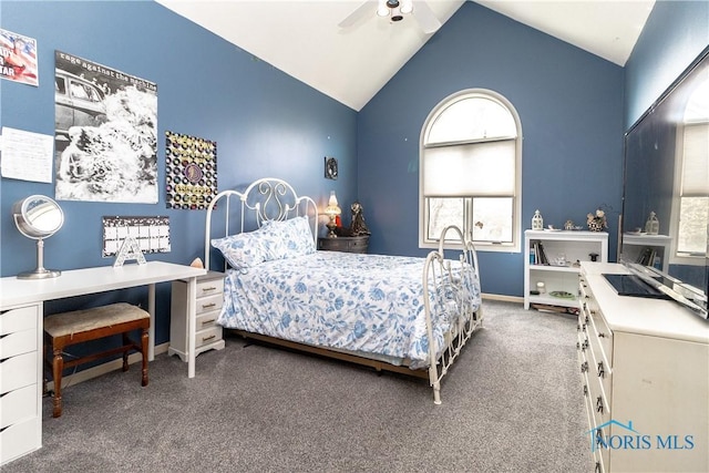 bedroom with carpet floors, multiple windows, and high vaulted ceiling