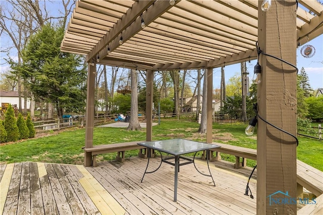 wooden terrace with a lawn, a pergola, and a fenced backyard