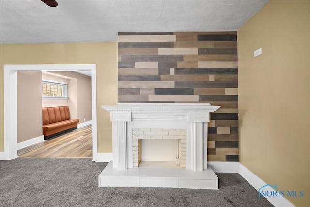 4242 Fairview Dr, Toledo, OH 43612 - unfurnished living room featuring carpet floors, baseboards, and a textured ceiling