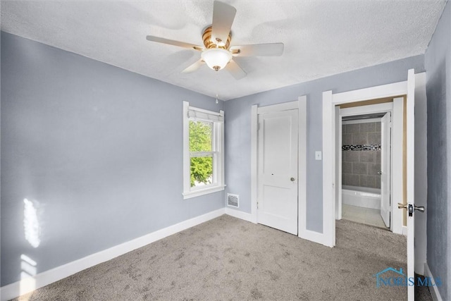 4242 Fairview Dr, Toledo, OH 43612 - unfurnished bedroom featuring baseboards, carpet flooring, a closet, a textured ceiling, and ceiling fan