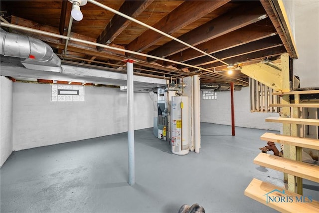 4242 Fairview Dr, Toledo, OH 43612 - below grade area featuring gas water heater, heating unit, and healthy amount of natural light