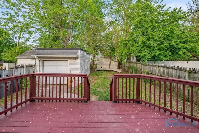 4242 Fairview Dr, Toledo, OH 43612 - wooden deck featuring a fenced backyard, an outbuilding, and a garage