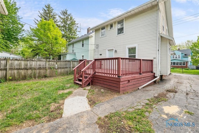 4242 Fairview Dr, Toledo, OH 43612 - rear view of house with fence and a deck