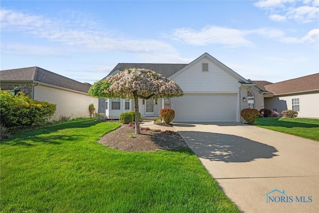view of front of home with an attached garage, concrete driveway, and a front yard