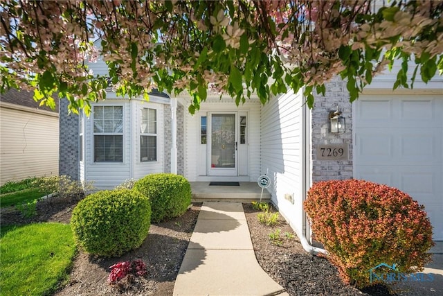 doorway to property featuring a garage