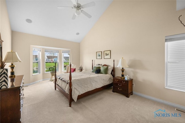 bedroom with carpet floors, baseboards, high vaulted ceiling, and visible vents