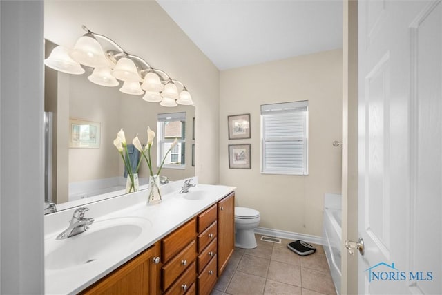 full bath with double vanity, a washtub, visible vents, and a sink