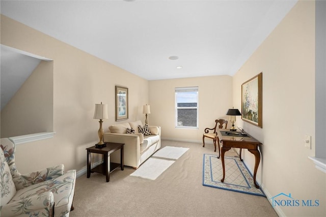 living room featuring baseboards and carpet flooring