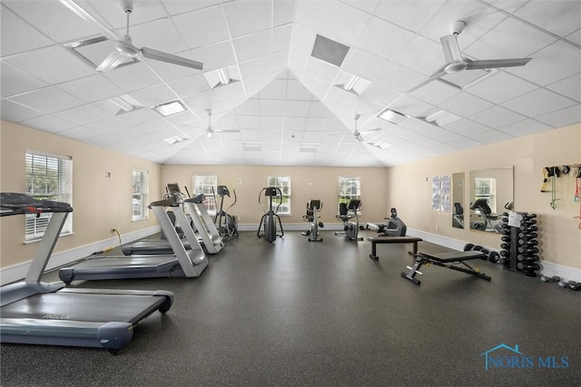 exercise room featuring baseboards and ceiling fan