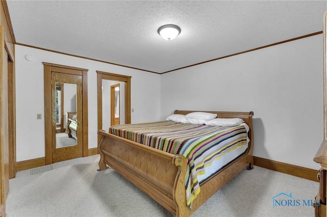 888 Columbus Ave, Fostoria, OH 44830 - bedroom with crown molding, baseboards, carpet flooring, and a textured ceiling