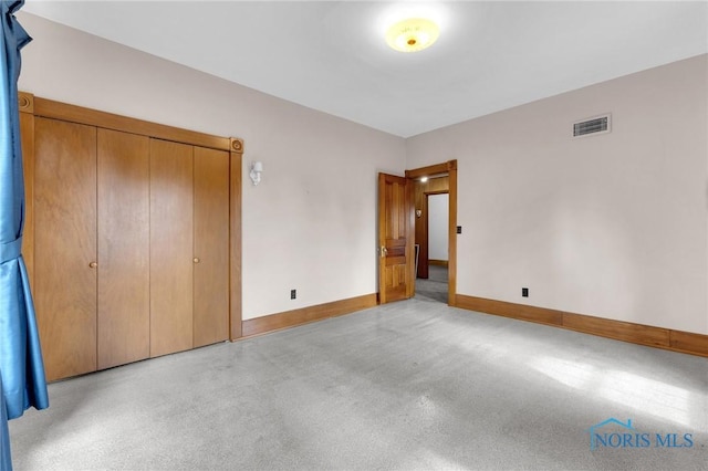 888 Columbus Ave, Fostoria, OH 44830 - unfurnished bedroom featuring baseboards and visible vents