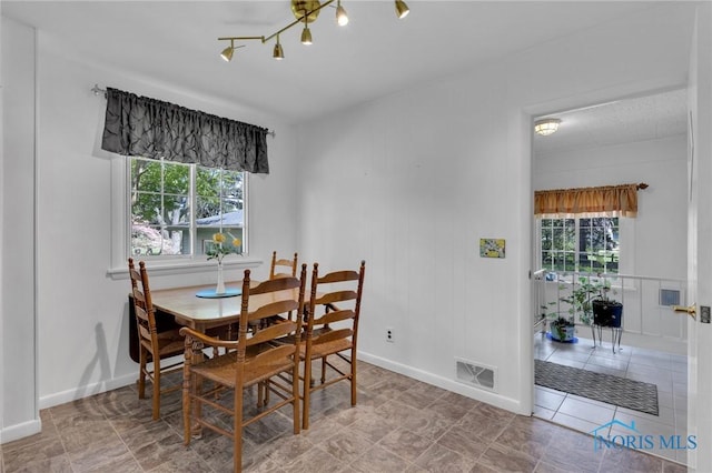 888 Columbus Ave, Fostoria, OH 44830 - dining space featuring plenty of natural light, baseboards, and visible vents